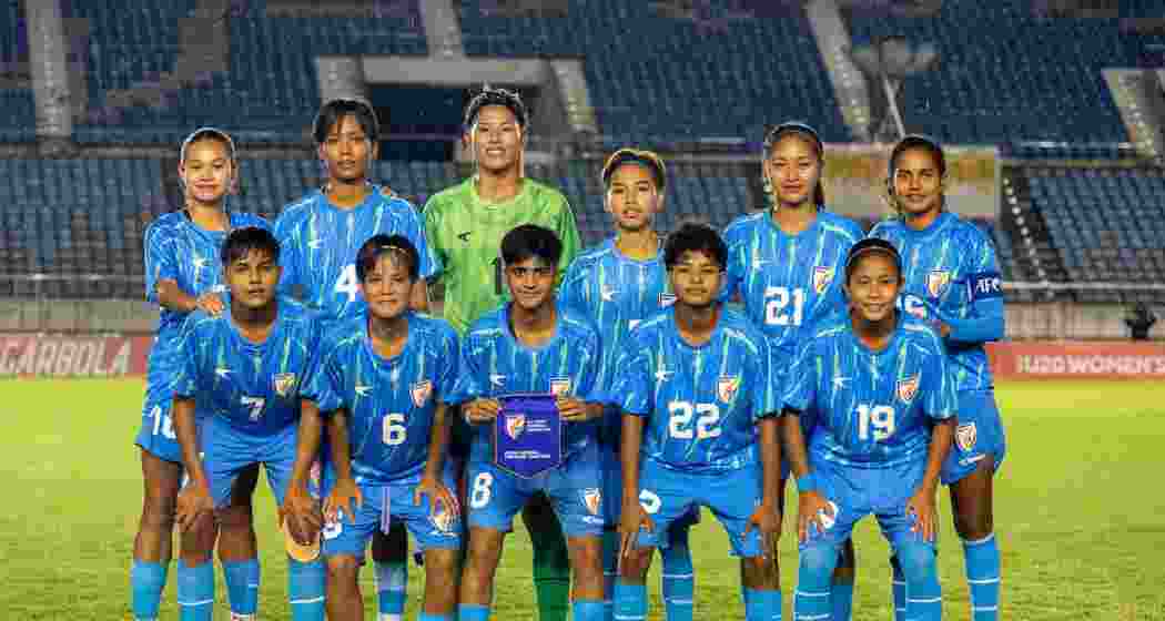 India's under-20 national women's football team members pose for a photograph.
