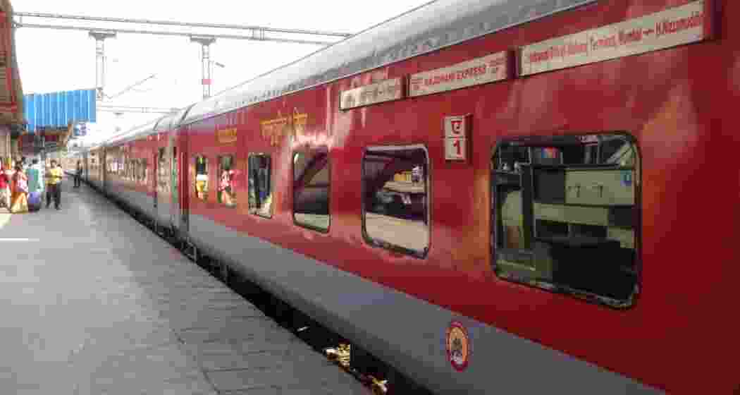 A Rajdhani Express stationed at a platform during its scheduled halt. 