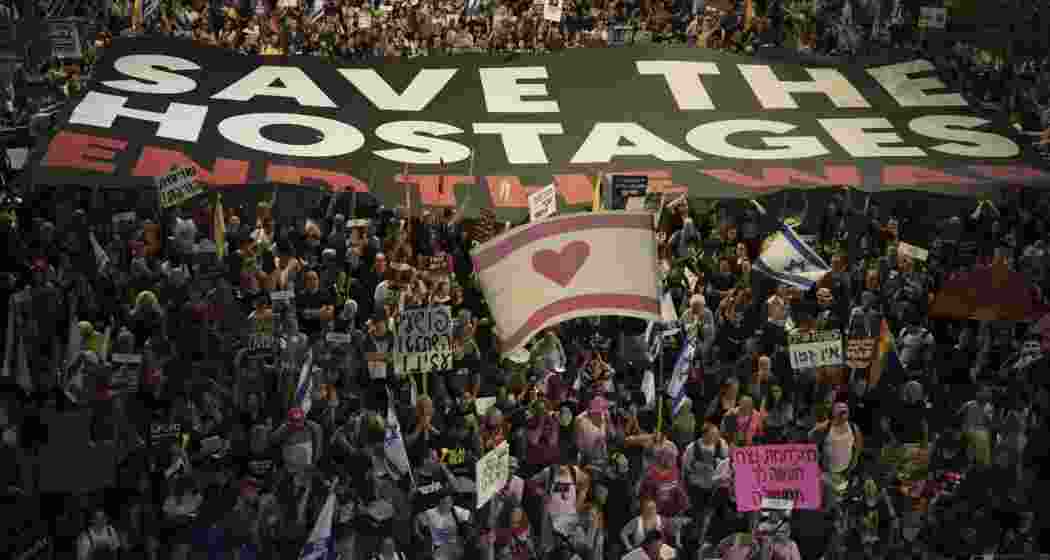 People take part in a protest demanding the end of the war and immediate release of hostages held by Hamas in the Gaza Strip, and against Prime Minister Benjamin Netanyahu's government in Tel Aviv, Israel, Saturday, May 24, 2025. 