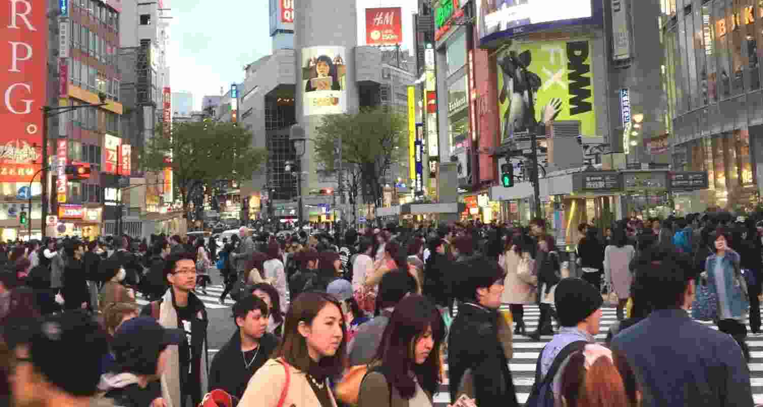 Japan's population fell below 120 million as births and fertility hit record lows, while the number of foreign residents reached an all-time high.