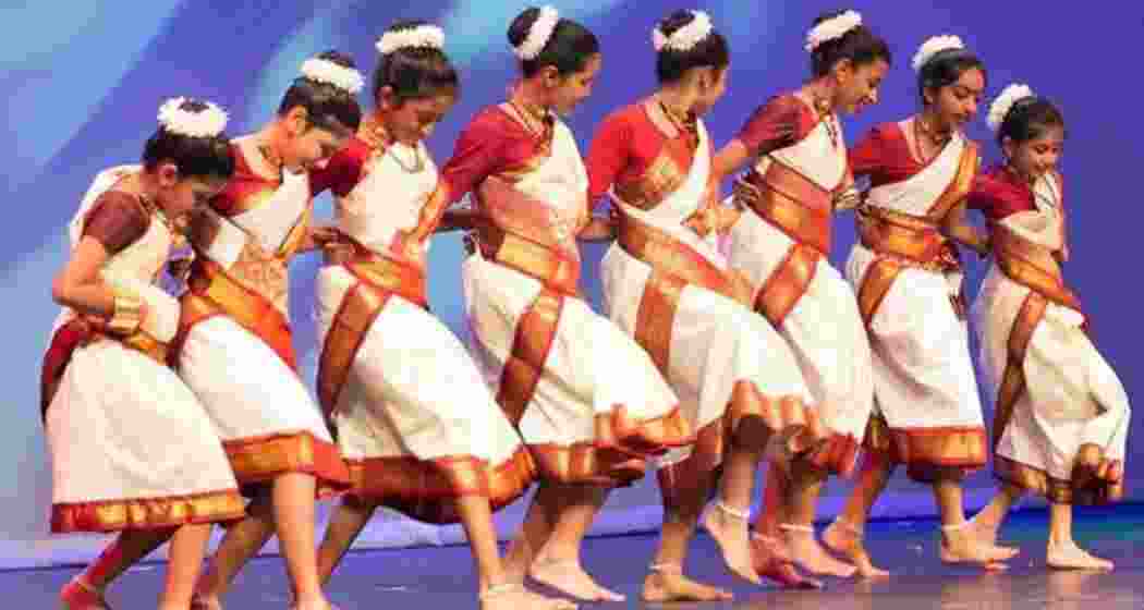 Assam Jhumur dancers in action, showcasing the vibrant traditional art form that embodies the cultural heritage of the tea tribes.