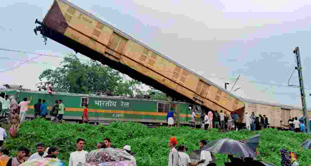 Locals gather after the Kanchanjungha Express was hit by a goods train near New Jalpaiguri station in Darjeeling district of West Bengal on June 17, 2024. Locals gather after the Kanchanjungha Express was hit by a goods train near New Jalpaiguri station in Darjeeling district of West Bengal on June 17, 2024.