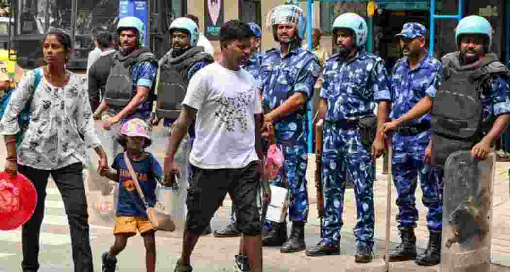 Rapid Action Force (RAF) personnel stand guard during a ’bandh’ called by farmers and Kannada organisations against the release of Cauvery river water to Tamil Nadu from dams in Karnataka, in Bengaluru, Tuesday, Sept. 26, 2023. The state is observing a bandh from 6 am to 6 pm on Saturday, March 22. 2025.