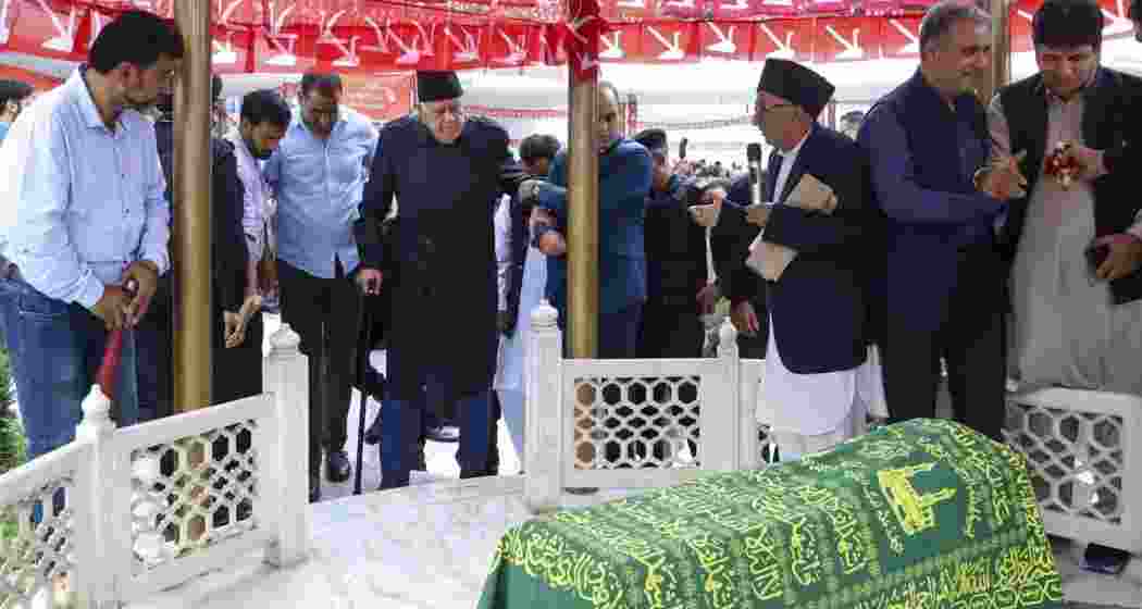 Jammu and Kashmir National Conference (JKNC) President Farooq Abdullah arrives to offer prayers at the grave of his father and party founder Sheikh Muhammad Abdullah on his death anniversary, in Srinagar.