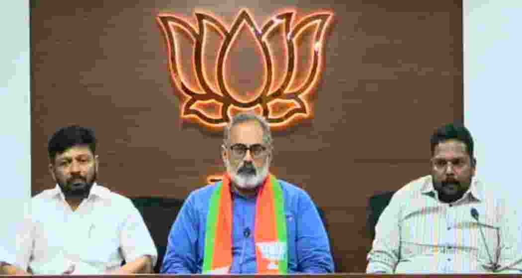 BJP Kerala president Rajeev Chandrasekhar along with the two former Congress leaders after they joined the party in Thiruvananthapuram ahead of Assembly elections.