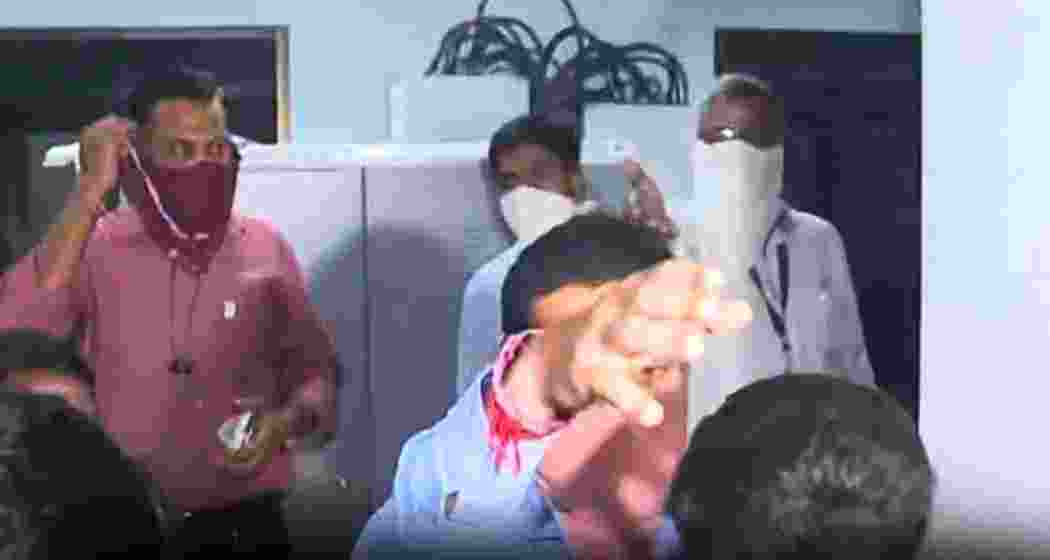 Election staff rush out of the SEC data centre in Kolkata as a fire breaks out during Kaliganj bypoll counting. The blaze was swiftly contained, averting serious disruption.