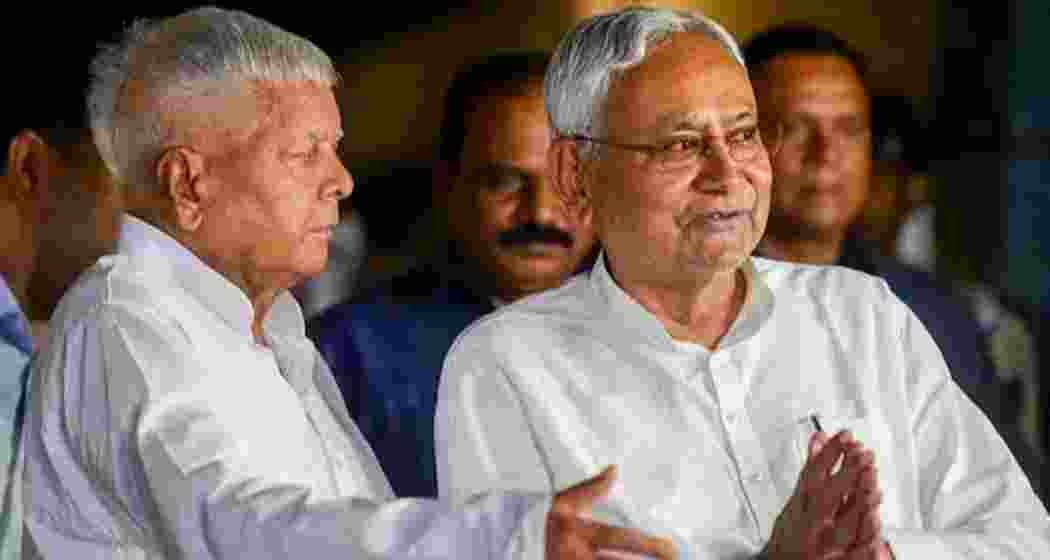 Former Bihar Chief Ministers Lalu Prasad Yadav and Nitish Kumar during a public event in Patna.