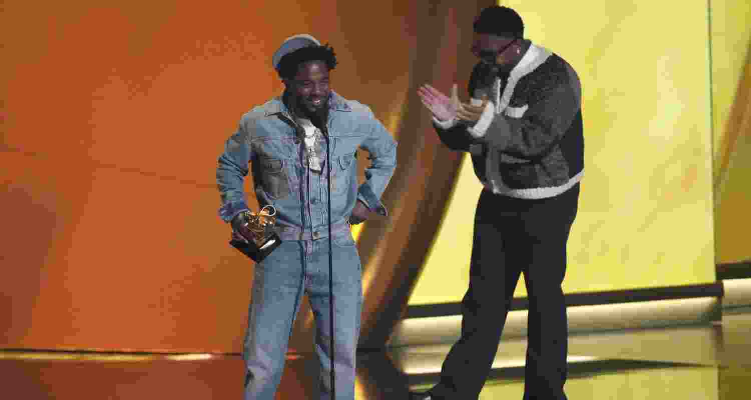 Kendrick Lamar, left, accepts the record of the year award for "Not Like Us during the 67th annual Grammy Awards on Sunday.