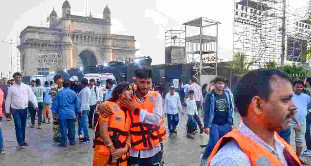 Baffled passengers near the Gateway of India after being rescued from the ferry-Navy disaster that claimed the lives on 14. 