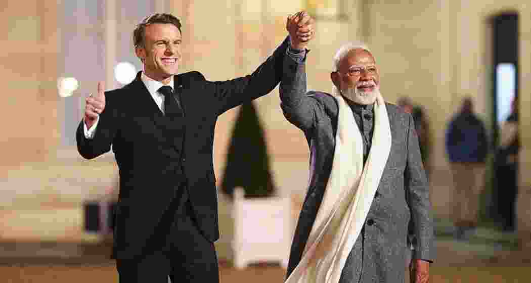 Indian Prime Minister Narendra Modi, right, is greeted by President of France Emmanuel Macron as he arrives for a reception at Palais de l'Elysee in Paris on Monday, Feb. 10, 2025.