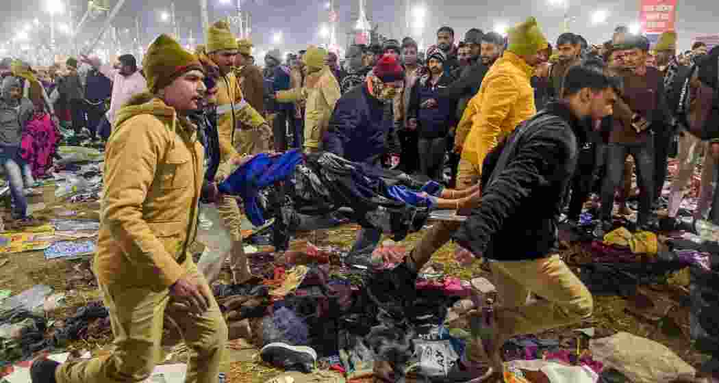 Police carry injured devotees following the deadly stampede at the Maha Kumbh Mela on January 29, which claimed 30 lives and injured over 60 pilgrims at Prayagraj.