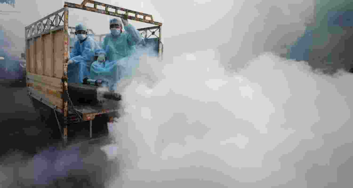 Municipal workers carry out fumigation to prevent the spread of malaria - file image.