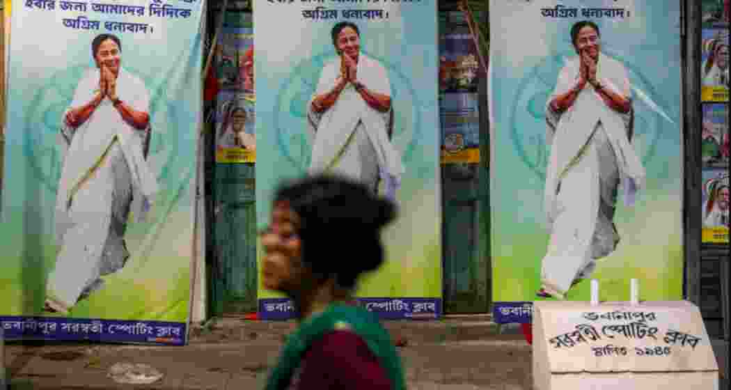 Banners featuring West Bengal Chief Minister Mamata Banerjee are installed ahead of the declaration of State Assembly election results, in Kalighat, Kolkata, West Bengal, on Sunday.