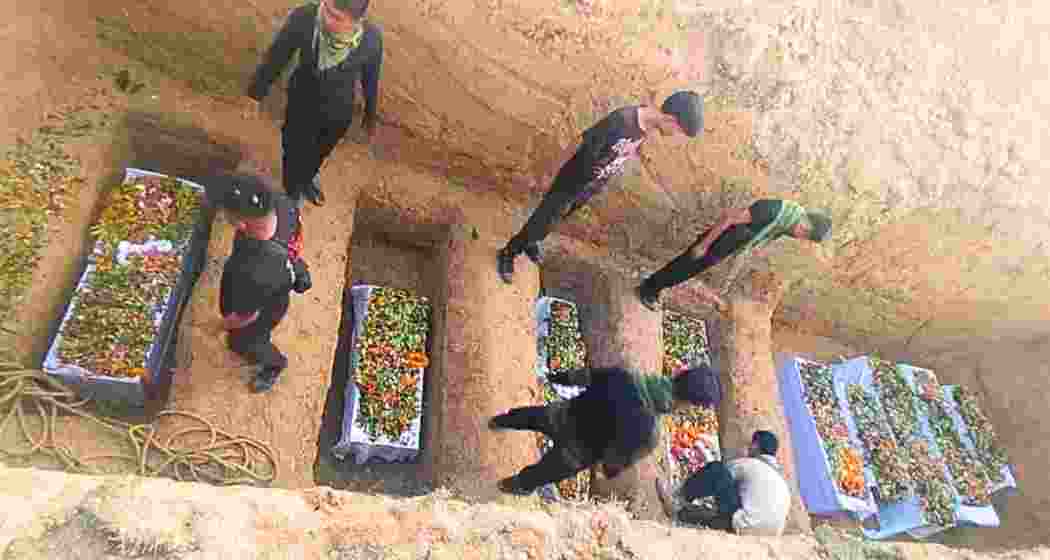 The bodies of nine Meitei victims of violence in Jiribam being buried following their last rites amid tight security and communal grief.