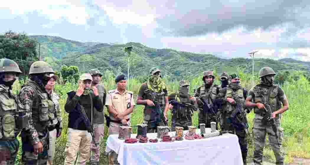 Security forces with a cache of arms and ammunition seized during a raid in Manipur. (File photo)