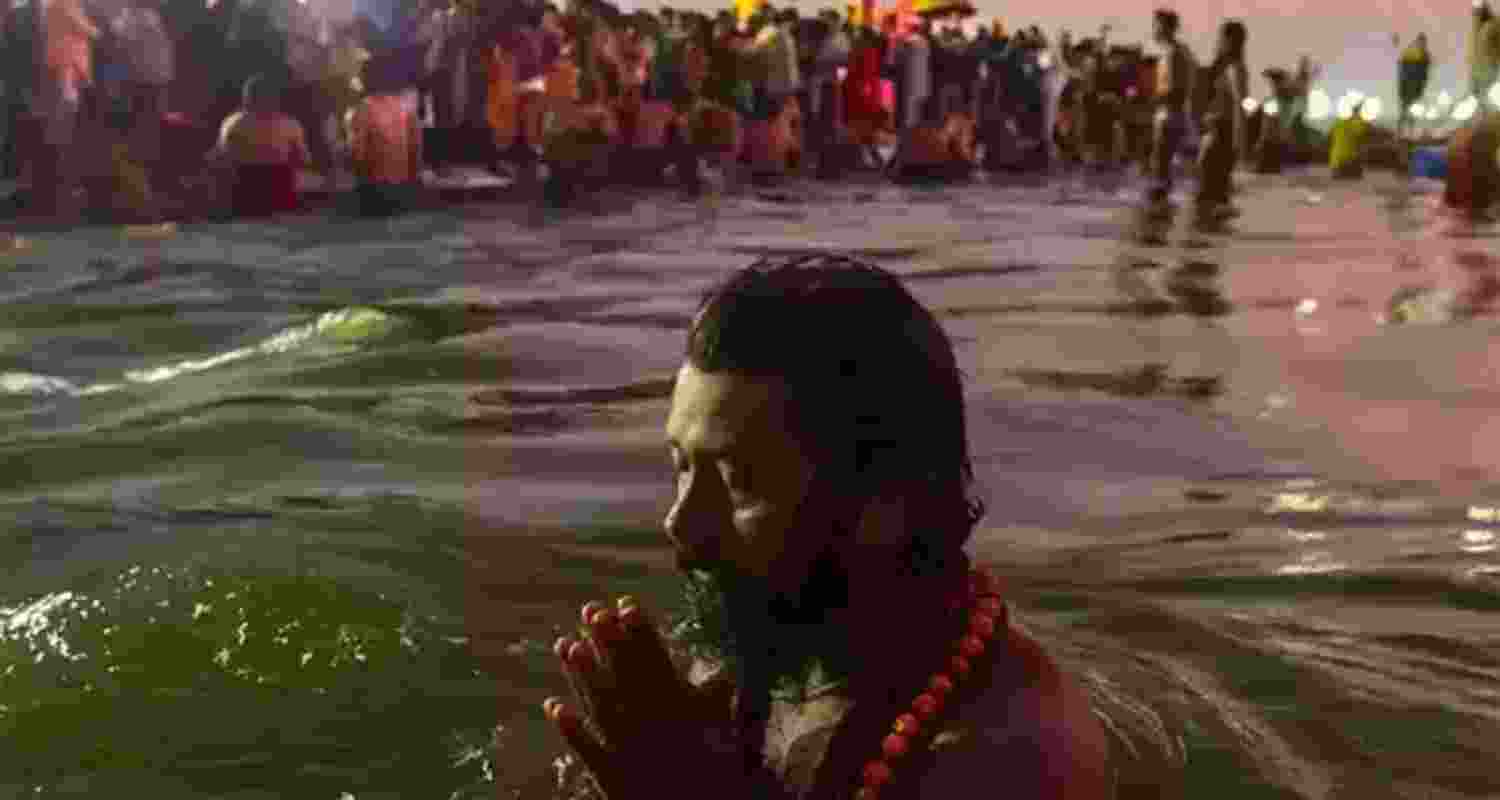 Devotees arrive to take holy dip at Sangam on the eve of 'Mauni Amavasya' during the ongoing Maha Kumbh Mela 2025, in Prayagraj, Tuesday.