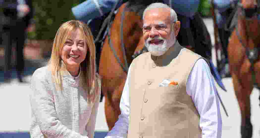 Italian Premier Giorgia Meloni, left, welcomes India's Prime Minister Narendra Modi upon his arrival at Villa Doria Pamphili in Rome for talks, on Wednesday.