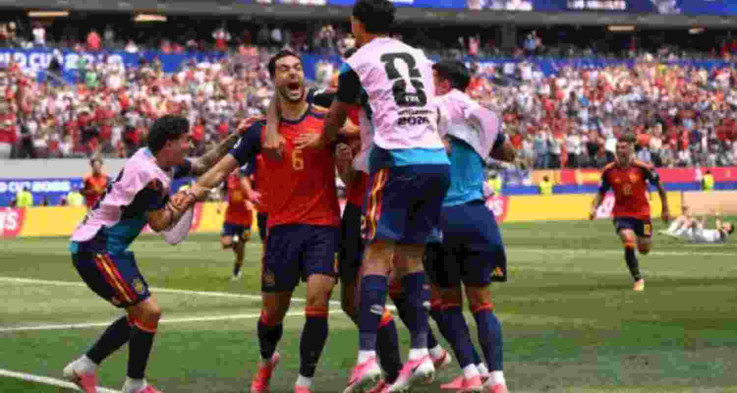Mikel Merino celebrates after scoring Spain's winning goal against Belgium.