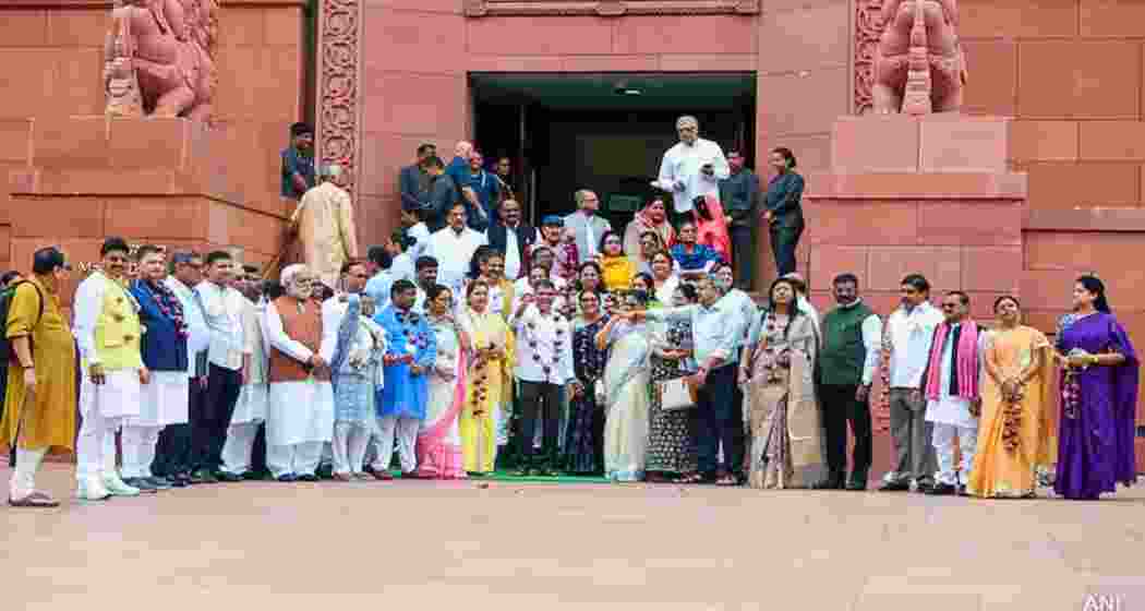 Opposition ministers stage a protest outside Parliament during the Monsoon Session.
