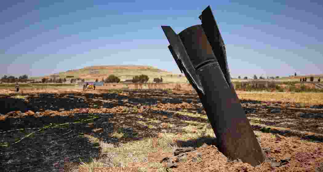 A projectile is seen in a burned agricultural field near the town of Najha, Syria, Monday, June 8, 2026, after debris from Iranian missile launches during the Iran-Israel conflict fell in the area.