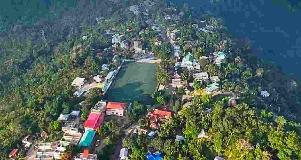 An aerial view of Kawrthah North Panchayat in Mizoram, showcasing rural settlement patterns and surrounding green landscapes, which won recognition at the National Panchayat Awards 2025 for clean and green governance.