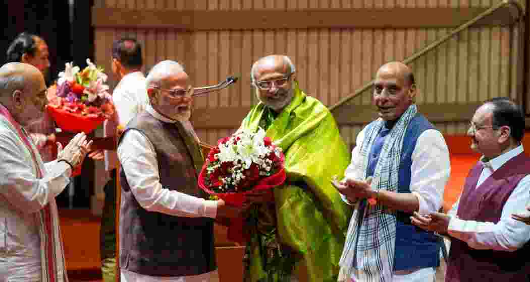 Prime Minister Narendra Modi felicitates Maharashtra Governor and NDA's vice presidential candidate C.P. Radhakrishnan as Defence Minister Rajnath Singh, Union Home Minister Amit Shah, and Union Minister and BJP National President J.P. Nadda applaud during the NDA parliamentary party meeting, in New Delhi. Prime Minister Narendra Modi felicitates Maharashtra Governor and NDA's vice presidential candidate C.P. Radhakrishnan as Defence Minister Rajnath Singh, Union Home Minister Amit Shah, and Union Minister and BJP National President J.P. Nadda applaud during the NDA parliamentary party meeting, in New Delhi.
