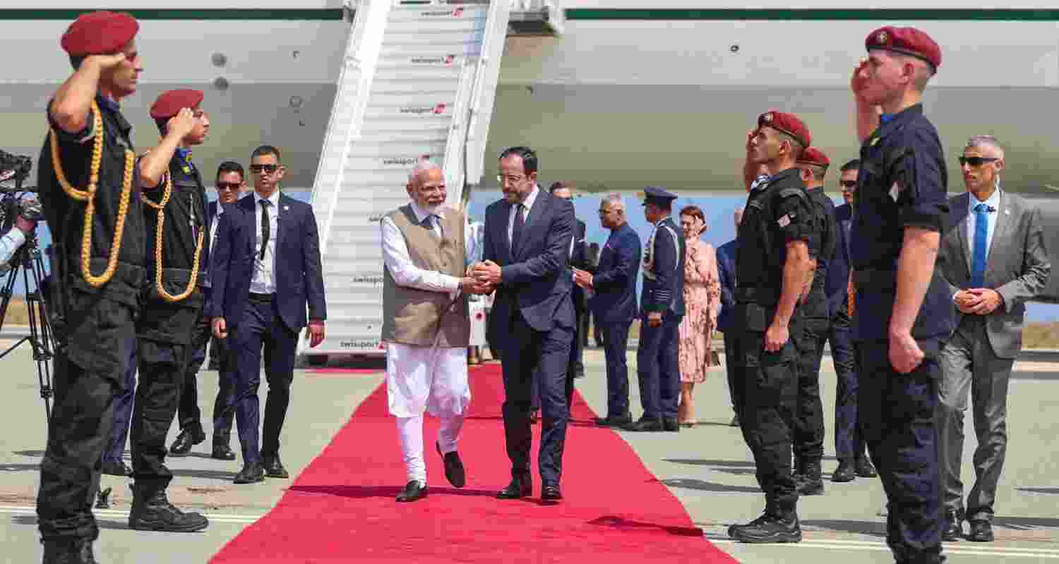 Prime Minister Narendra Modi being received by the President of Cyprus Nikos Christodoulides upon his arrival at the airport, in Larnaca, Cyprus. 