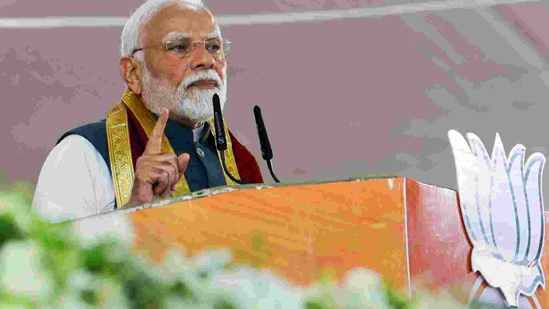 Prime Minister Narendra Modi addresses a public meeting, in Alipurduar, West Bengal.