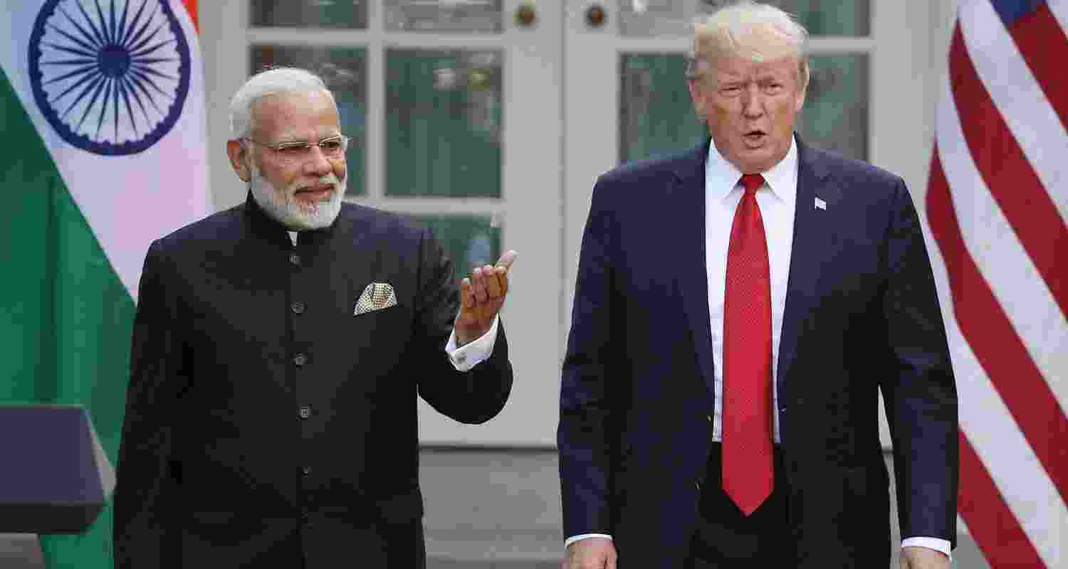 A file photo of U.S. President Donald Trump and Indian Prime Minister Narendra Modi walk up to deliver joint statements in the Rose Garden of the White House.