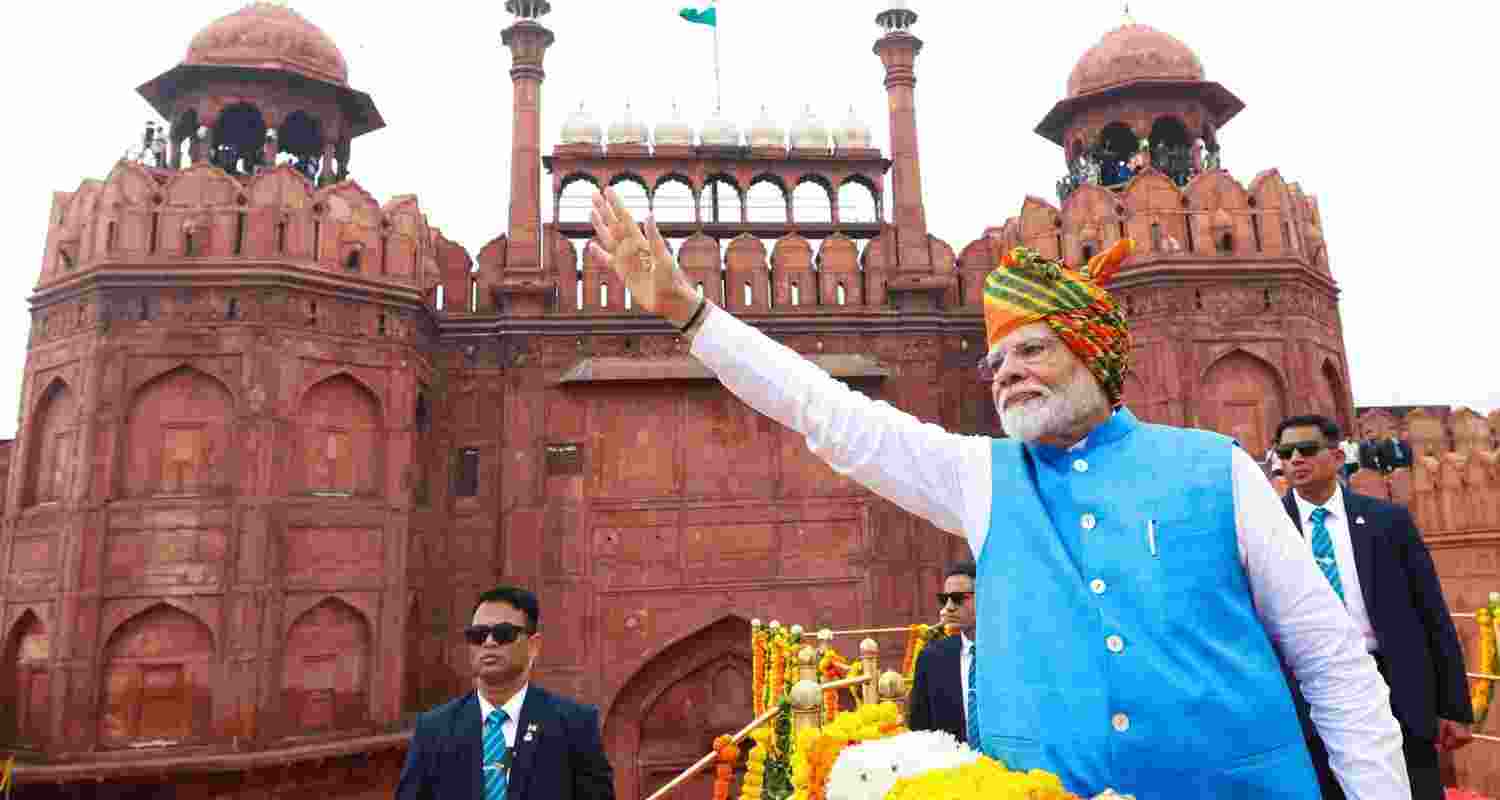 PM Modi waves to the audience at the Red Fort on the occasion of independence Day. PM Modi waves to the audience at the Red Fort on the occasion of independence Day.