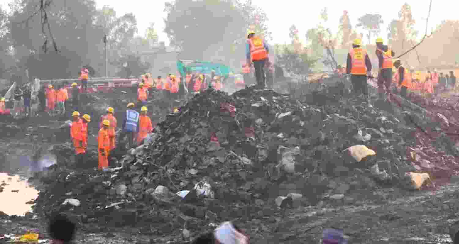 Rescue officials at the site of the firecracker factory where an explosion and subsequent blaze on Tuesday killed at least 11 people and injured nearly 200 others in Harda district on Wednesday. Rescue officials at the site of the firecracker factory where an explosion and subsequent blaze on Tuesday killed at least 11 people and injured nearly 200 others in Harda district on Wednesday.