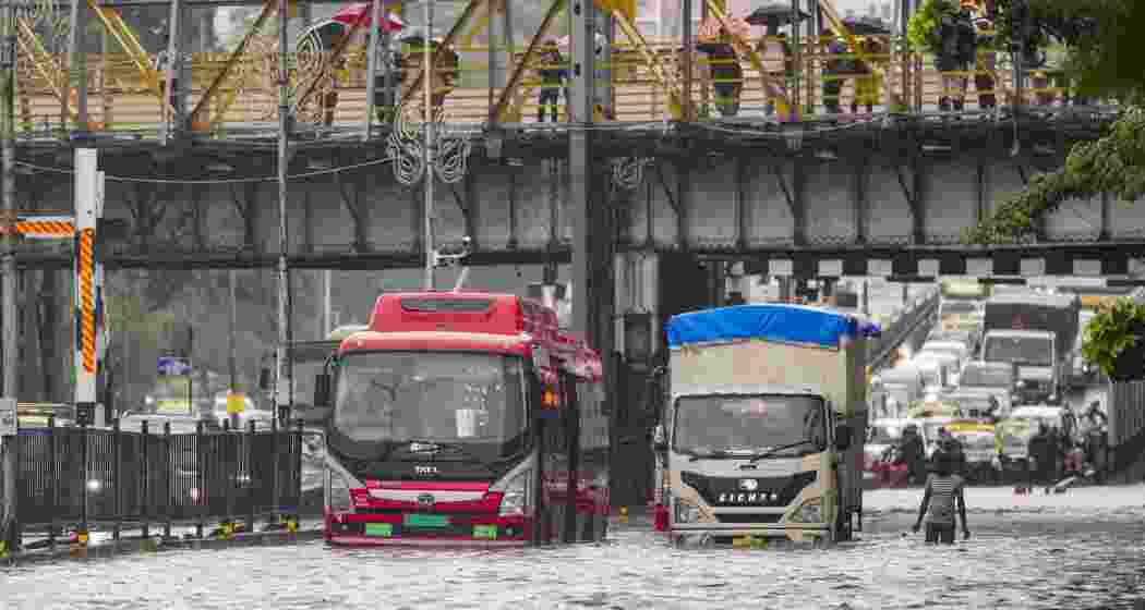  Vehicles make their way through a waterlogged road near Gandhi Market at Matunga after heavy rains, in Mumbai, Monday, May 26, 2025.