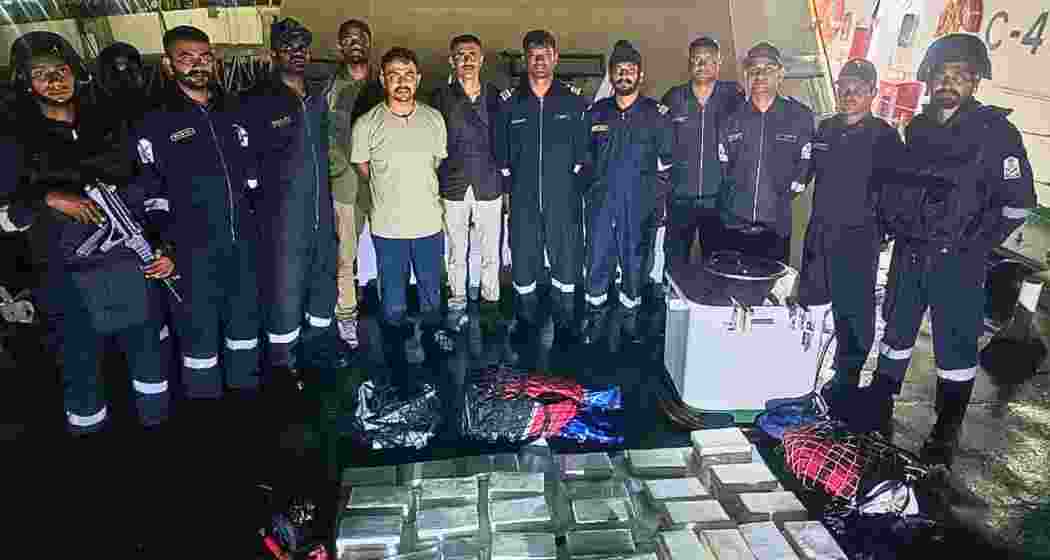 Gujarat ATS and Indian Coast Guard personnel display the seized cocaine following a joint anti-narcotics operation off the Gujarat coast near Mundra port.