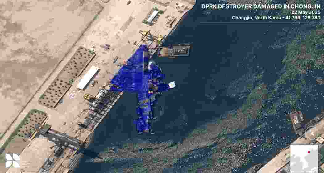 North Korea’s 5,000-tonne destroyer lies partially submerged at a shipyard following a failed launch.