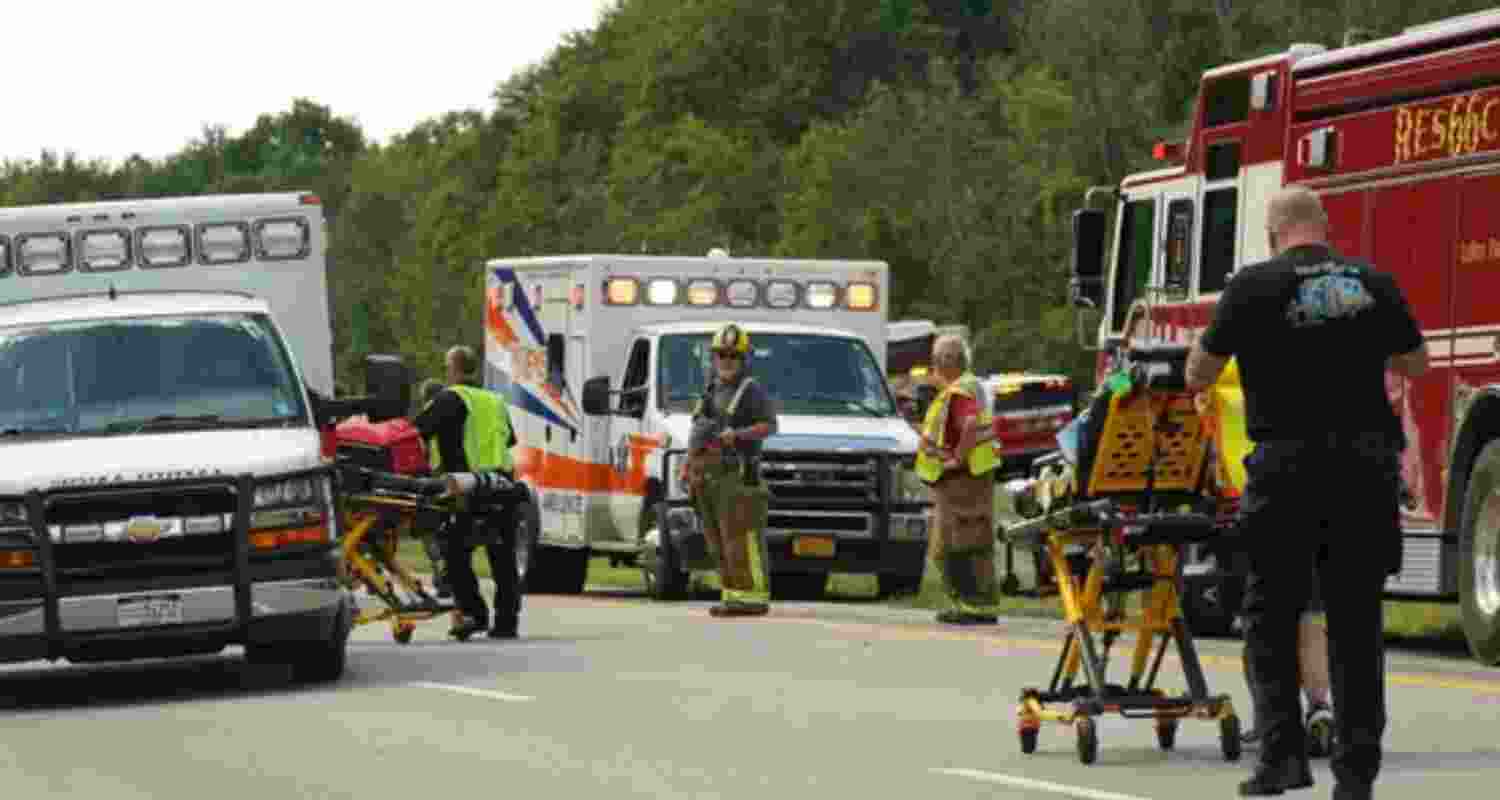 Rescue personnel work the scene of a tour bus that crashed and rolled over on the New York State Thruway near Pembroke, N.Y.