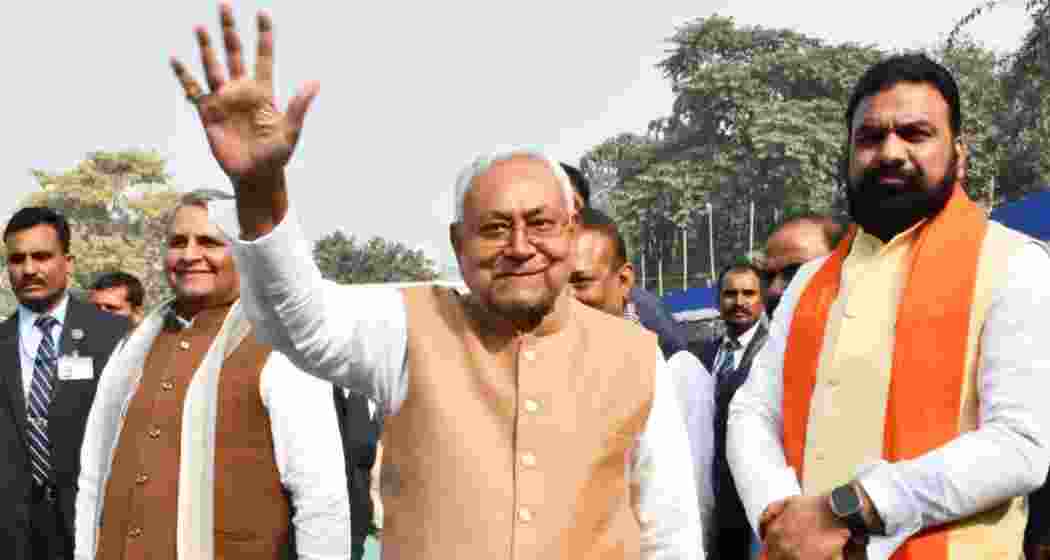 Bihar Chief Minister Nitish Kumar waves to supporters as Deputy Chief Minister Samrat Choudhary (R) looks on, in Patna. Bihar Chief Minister Nitish Kumar waves to supporters as Deputy Chief Minister Samrat Choudhary (R) looks on, in Patna.