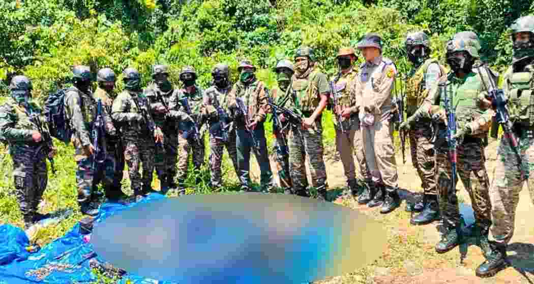 Security personnel in Arunachal Pradesh’s Changlang district display the bodies of two suspected NSCN militants in the Doimukh Nalla area.