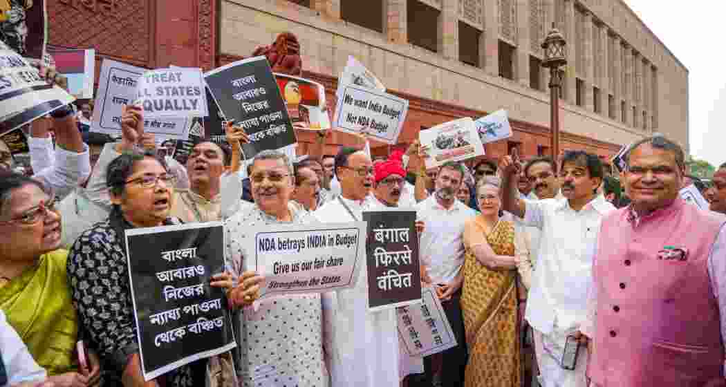 Lok Sabha LoP Rahul Gandhi, Congress MP Sonia Gandhi and others during an Opposition's protest inside Parliament premises claiming discrimination in Union Budget 2024 during the Monsoon session, in New Delhi, Wednesday, July 24, 2024. Lok Sabha LoP Rahul Gandhi, Congress MP Sonia Gandhi and others during an Opposition's protest inside Parliament premises claiming discrimination in Union Budget 2024 during the Monsoon session, in New Delhi, Wednesday, July 24, 2024.