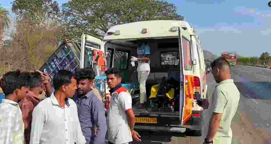 Rescue personnel and local residents carry out rescue operations after a container truck collided with a tempo carrying wedding guests on the Mumbai-Ahmedabad National Highway in Maharashtra’s Palghar district on Monday.