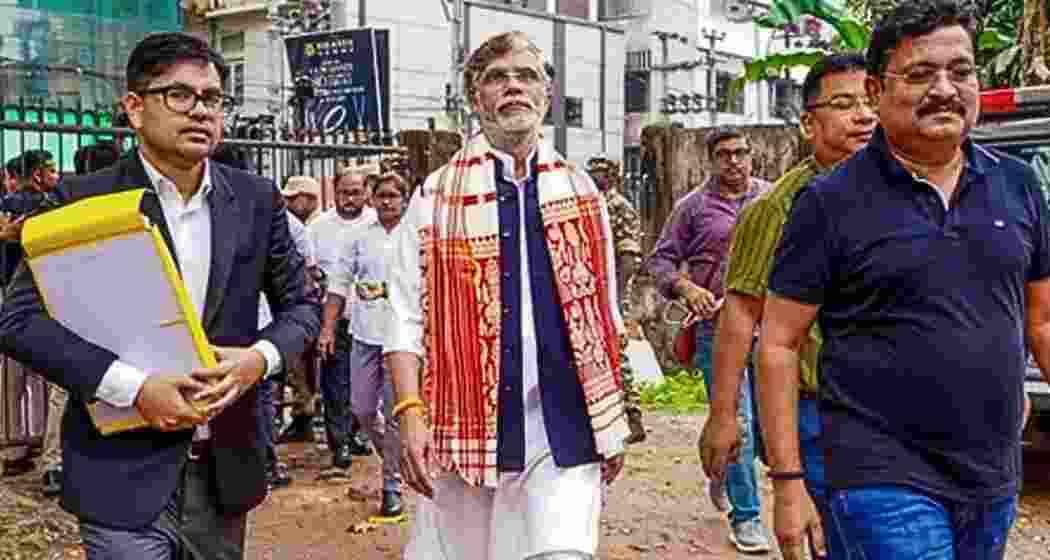 Congress leader Pawan Khera arrives at the Assam Police Crime Branch office in Guwahati on Wednesday for questioning in connection with complaints filed by Riniki Bhuyan Sarma.