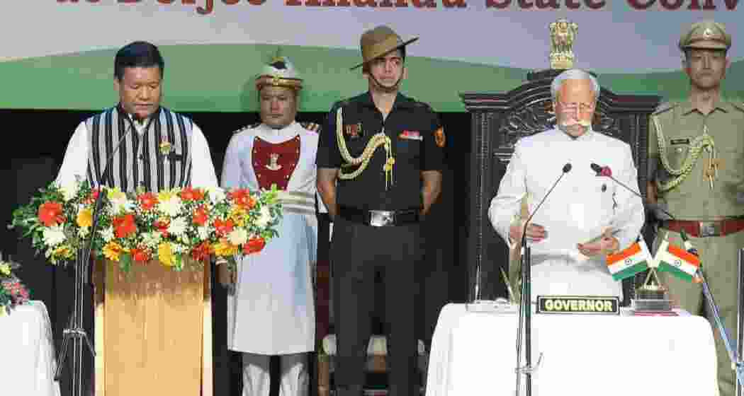 Arunachal Pradesh Governor Kaiwalya Trivikram Parnaik administers oath of office to state Chief Minister-designate Pema Khandu, at the DK State Convention Centre in Itanagar, Thursday, June 13, 2024.