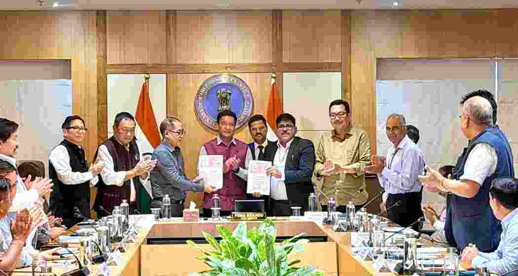 Arunachal Pradesh Chief Minister Pema Khandu and NHPC officials exchange documents after signing the agreement for the 3,097 MW Etalin Hydroelectric Project in Dibang Valley.