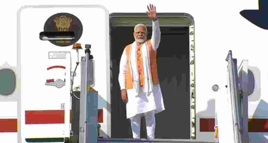 PM Modi waves before boarding his flight from New Delhi on Wednesday, beginning a five-nation diplomatic tour with stops in Africa, South America, and the Caribbean. The tour marks his longest diplomatic visit in nearly a decade. PM Modi waves before boarding his flight from New Delhi on Wednesday, beginning a five-nation diplomatic tour with stops in Africa, South America, and the Caribbean. The tour marks his longest diplomatic visit in nearly a decade.