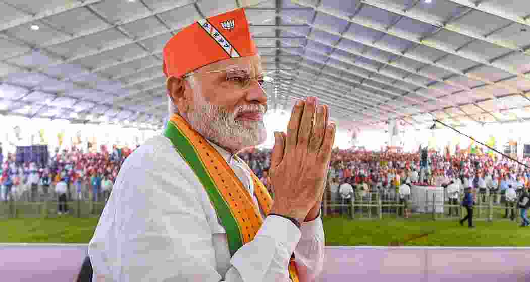 Prime Minister Narendra Modi greets the crowd with a namaste during a public event. (File photo)