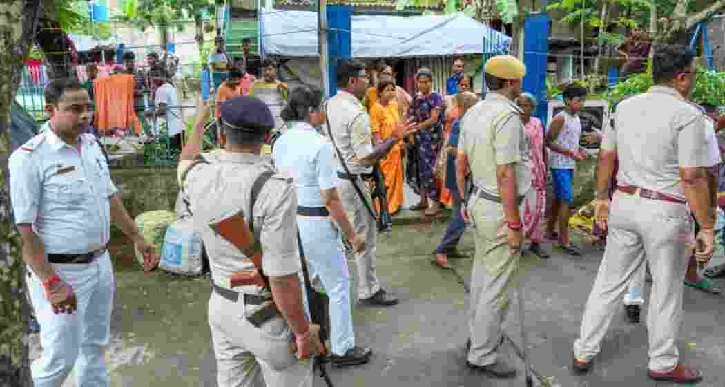 Security people arrive to intervene after tension between two political groups elections in North 24 Pargana district of West Bengal. Photo: PTI