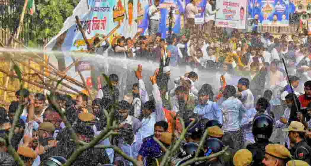 Police use water cannons to disperse Congress workers protesting the alleged NEET-UG paper leak in Jaipur on Wednesday.