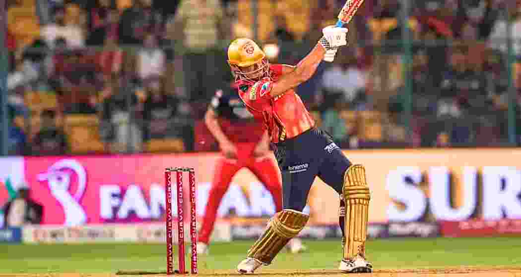 Marcus Stoinis plays a powerful shot during his innings, showcasing clean timing and intent as he looks to anchor the chase for Lucknow Super Giants in the IPL clash in Bengaluru on Friday.