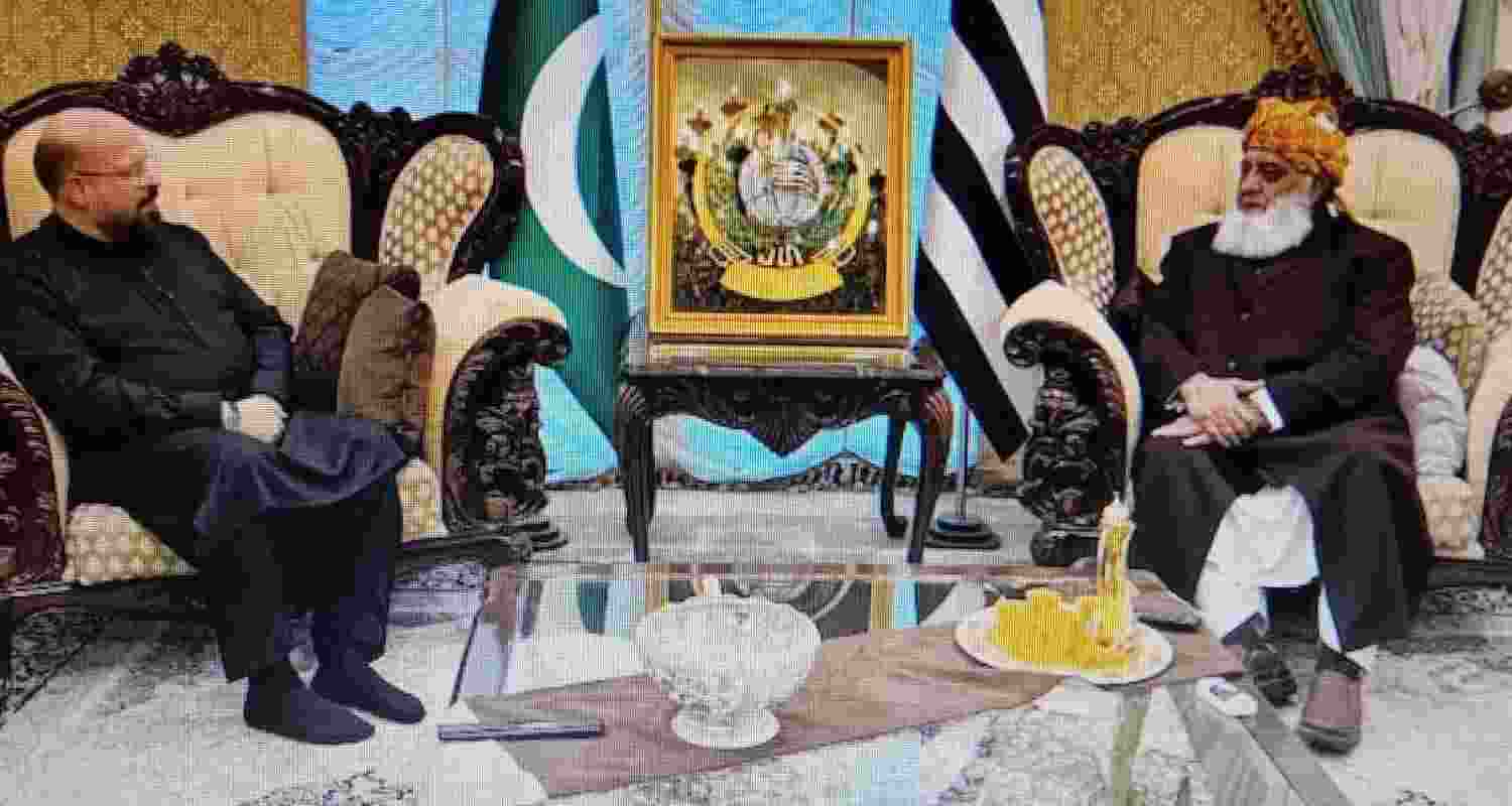 Quadoumi (Hamas) with chief of Jamait Ulema-e-Islam (F) Maulana Fazlur Rehman at the conference.