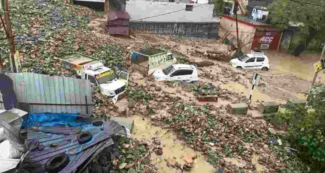 Vehicles submerged in sludge and debris after a cloudburst caused landslides and flash floods in Ramban, Jammu and Kashmir, leaving three dead and disrupting traffic. 