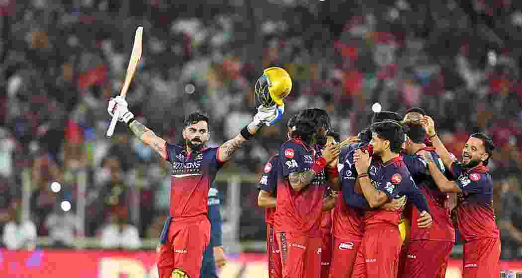 Royal Challengers Bengaluru's Virat Kohli, left, and others celebrate after winning the Indian Premier League (IPL) 2026 Final T20 cricket match between Royal Challengers Bengaluru and Gujarat Titans, in Ahmedabad, Gujarat, Sunday, May 31, 2026. (PTI Photo/Ravi Choudhary)
